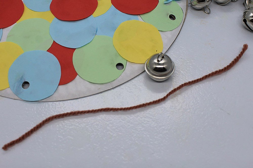How to Make a Paper Plate Tambourine - Step 16